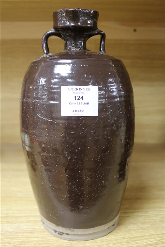 A Chinese late Ming brown glazed spouted jar